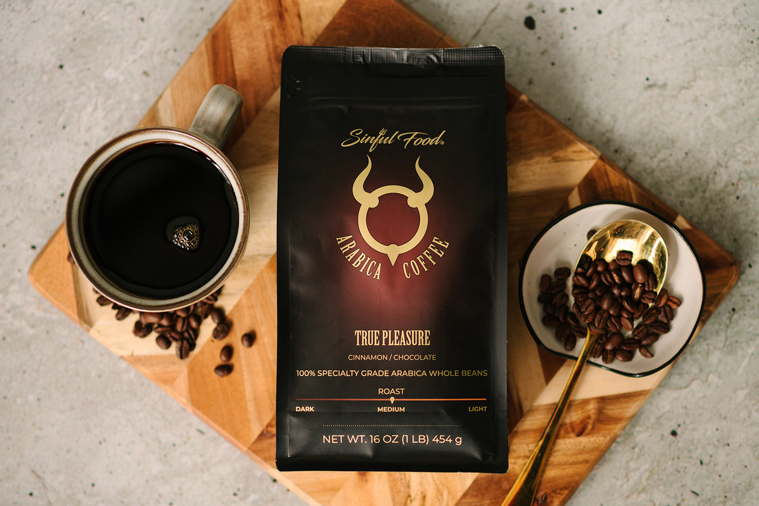 A picture of a bag of coffee, coffee and coffee beans.
