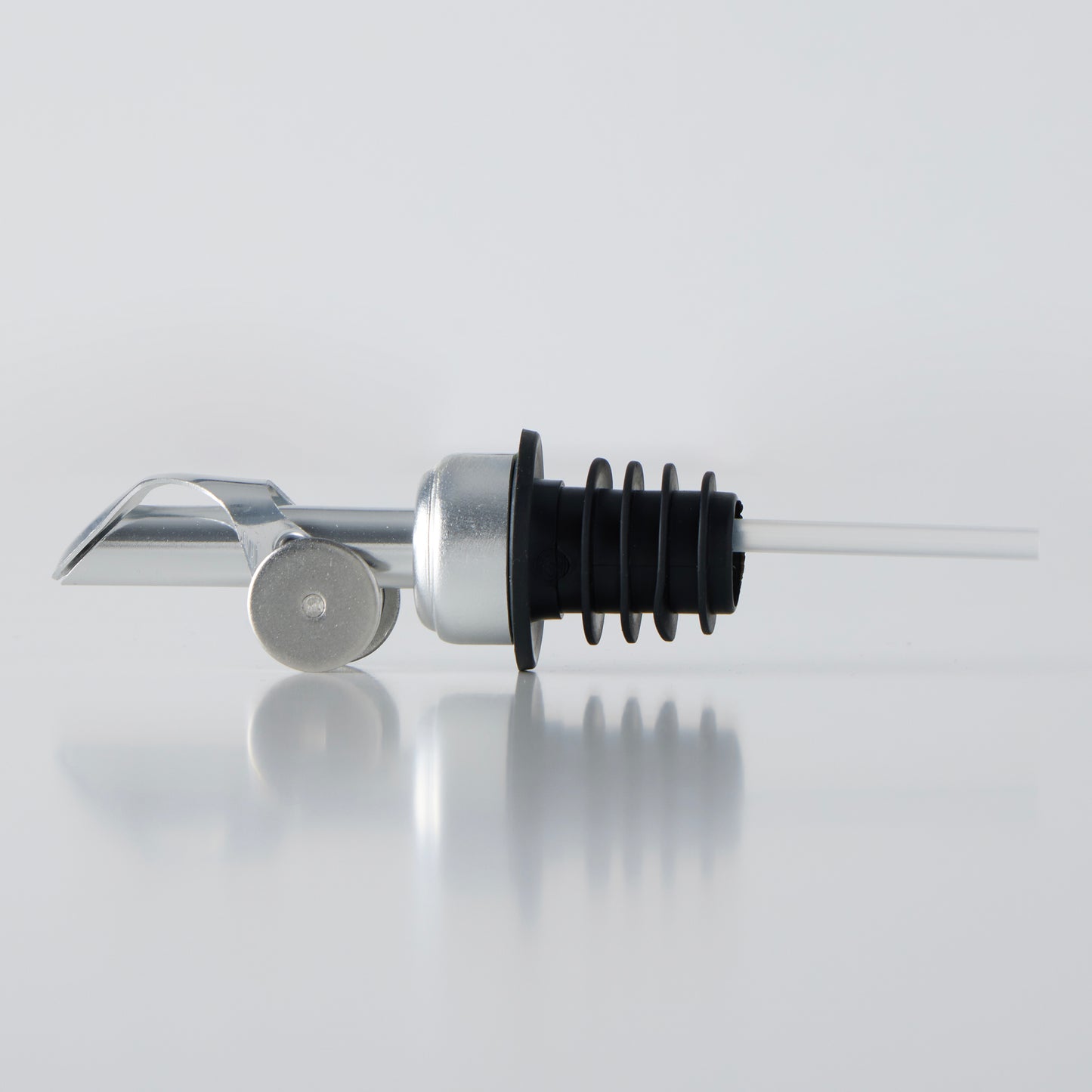 A silver olive oil dispenser.