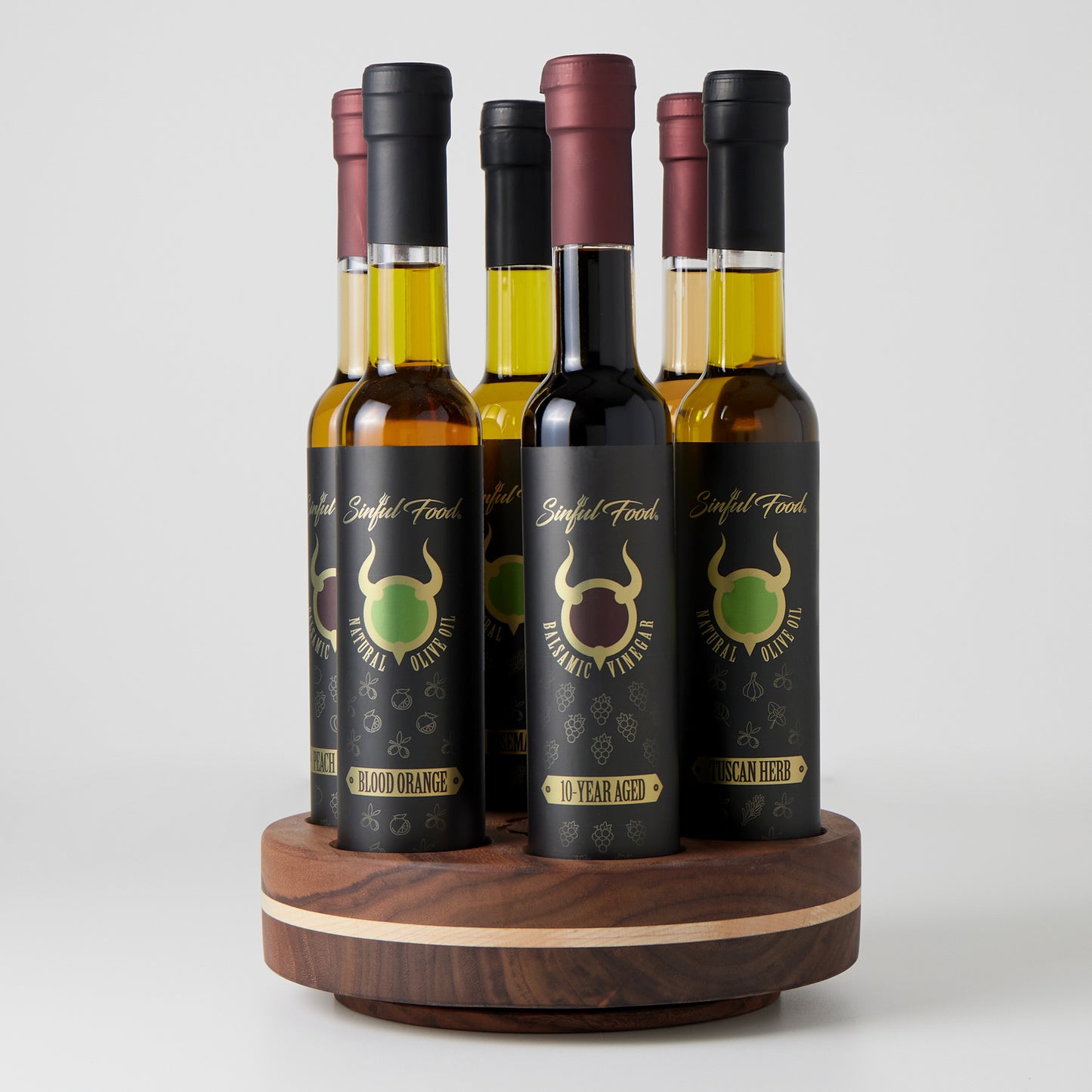 A lazy susan with balsamic vinegar and olive oil.
