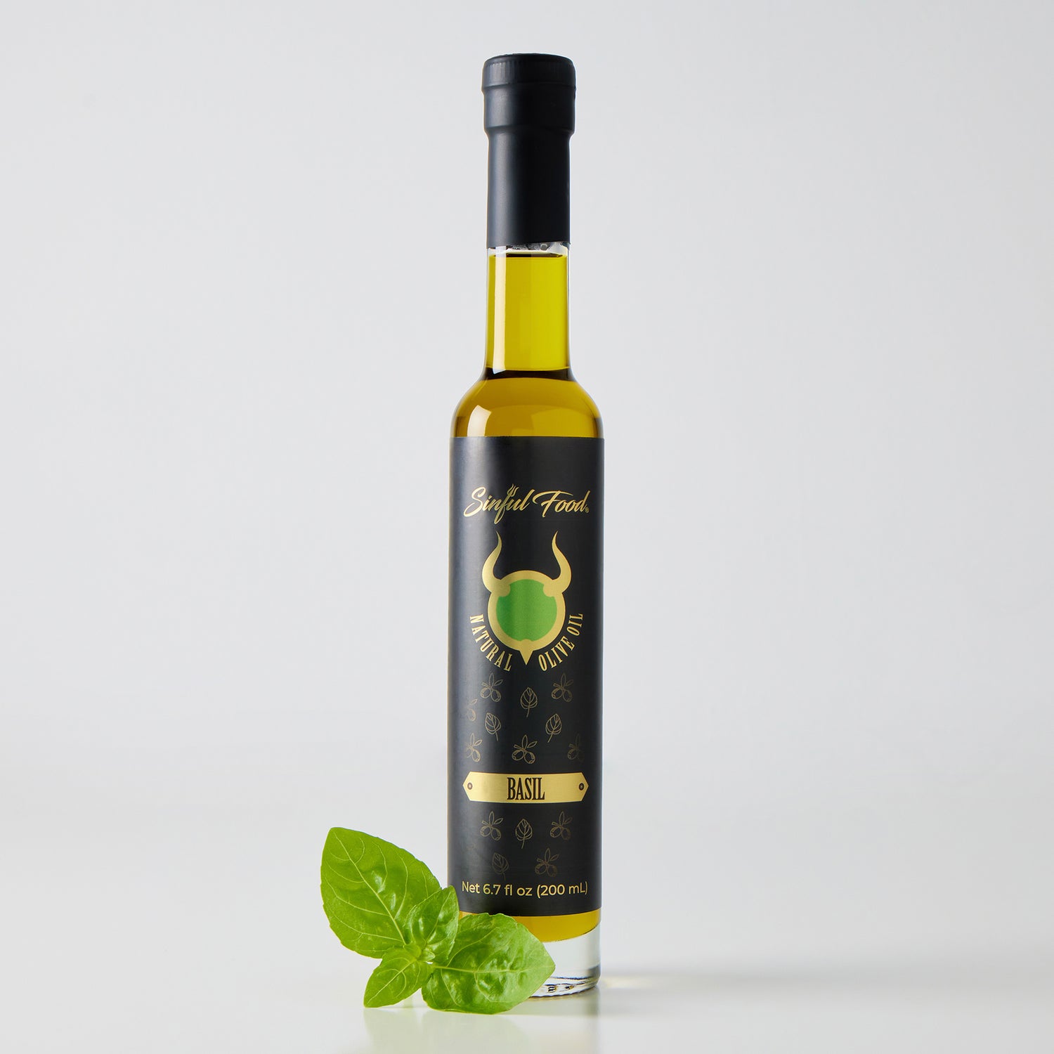 A bottle of Sinful Food Basil Olive Oil.